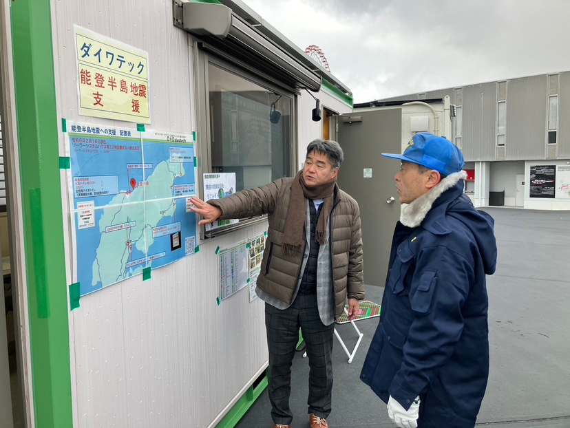 picture of a Daiwatech staff member explaining his activities in Noto