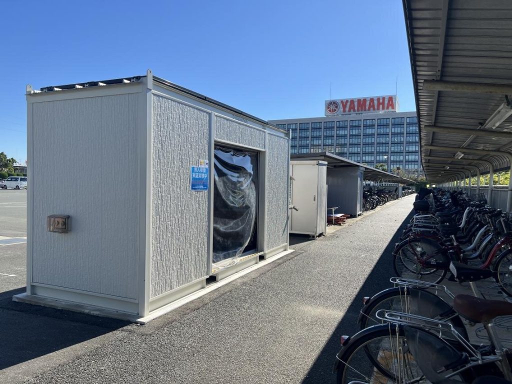 picture of demonstration to recycle used batteries for power assist bicycle charging stations at Yamaha Motor Co., Ltd.